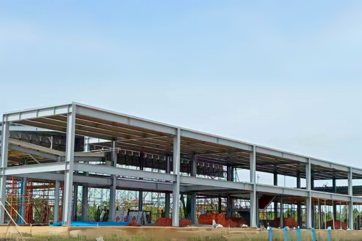 Steel framework of the Emerald E-Commerce Center under construction in Naypyidaw, Myanmar, showcasing the multi-story super structure.