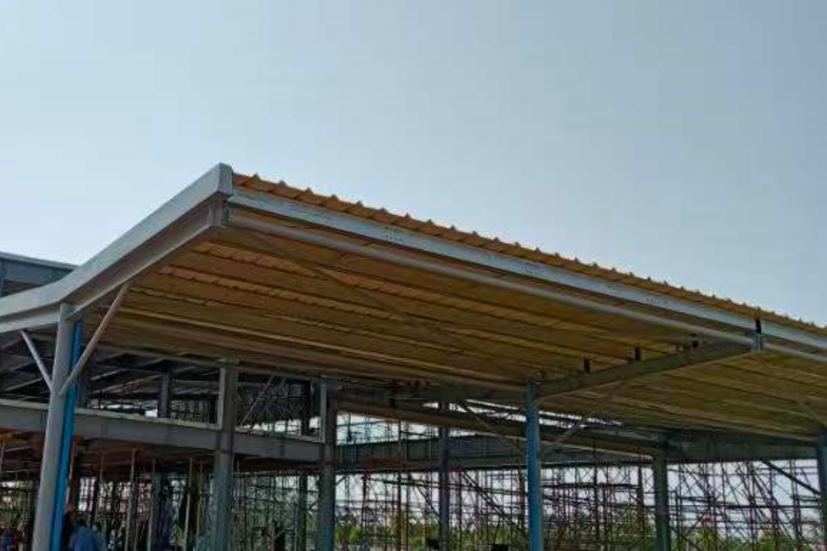 Exterior view of a section of the Emerald E-Commerce Center in Naypyidaw, Myanmar, featuring a completed canopy or roofline detail.