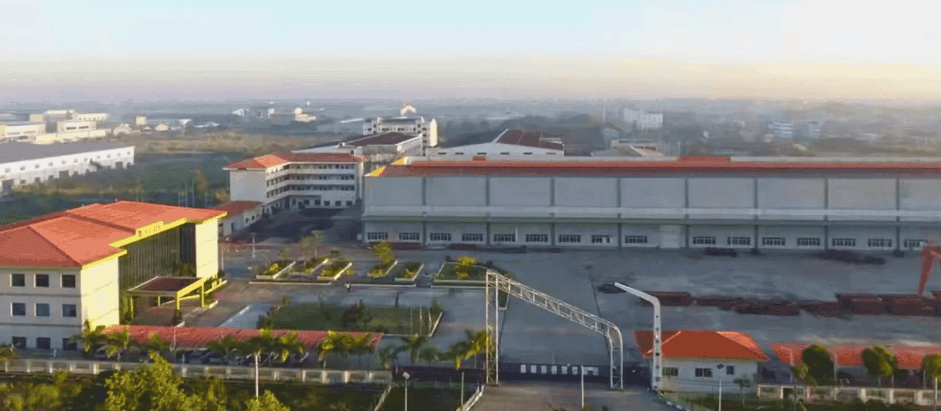 Aerial view of the Myanmar Yijin company complex with modern buildings and red roofs