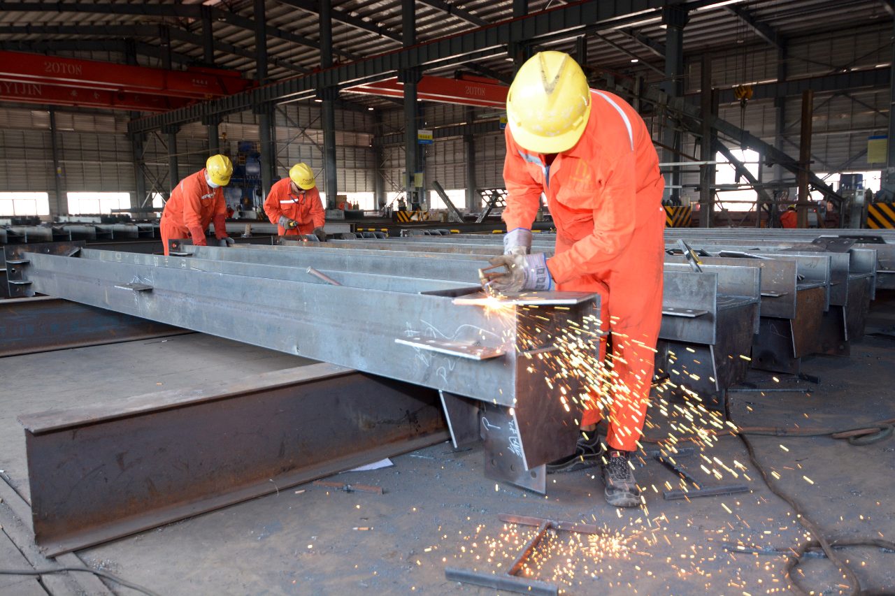 close-up of welders using welding torches to perform precision steel fabrication at Myanmar Yi Jin Steel Structure Fabrication factory