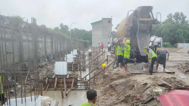 Reinforced concrete foundation and steel column base setup for factory warehouse extension in Yangon