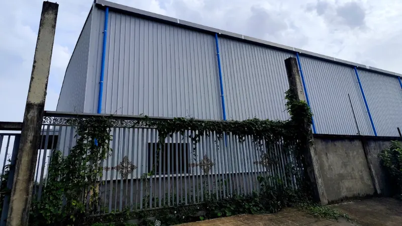 Exterior metal wall cladding and window installation for Oriental Light Co. Ltd steel structure warehouse