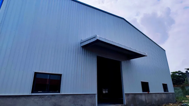 Turnkey entrance canopy and doorway installation for Oriental Light Co. Ltd warehouse facility