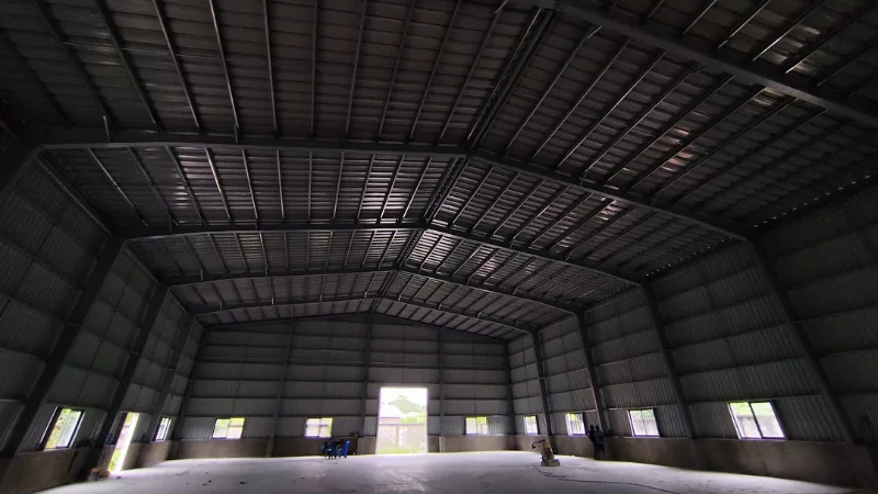 Completed interior structural steel framing and floor slab for 160ft x 80ft x 8m warehouse for Oriental Light Co. Ltd