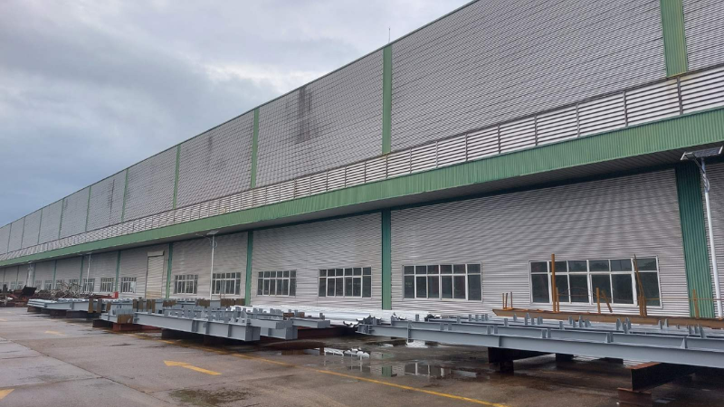 Fabricated structural steel columns and beams stored in the Myanmar Yi Jin factory yard for the Aung Kan Bo project